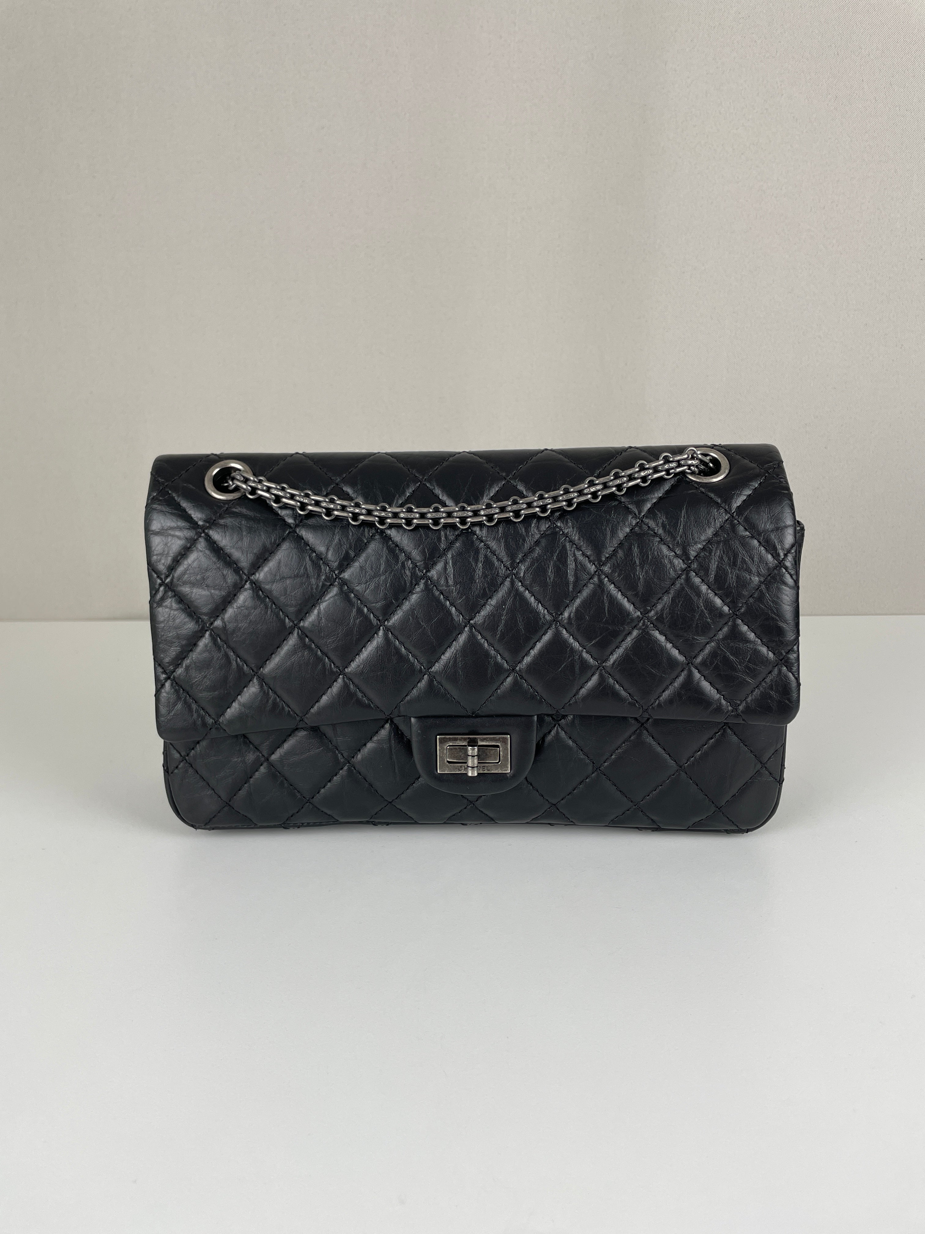 Chanel 2.55 jumbo black leather handbag silver hardware